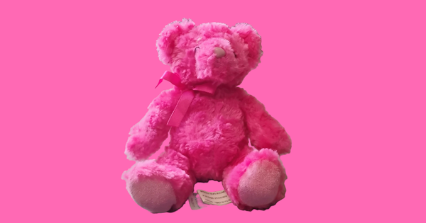 hot pink bear plushie atop a hot pink background